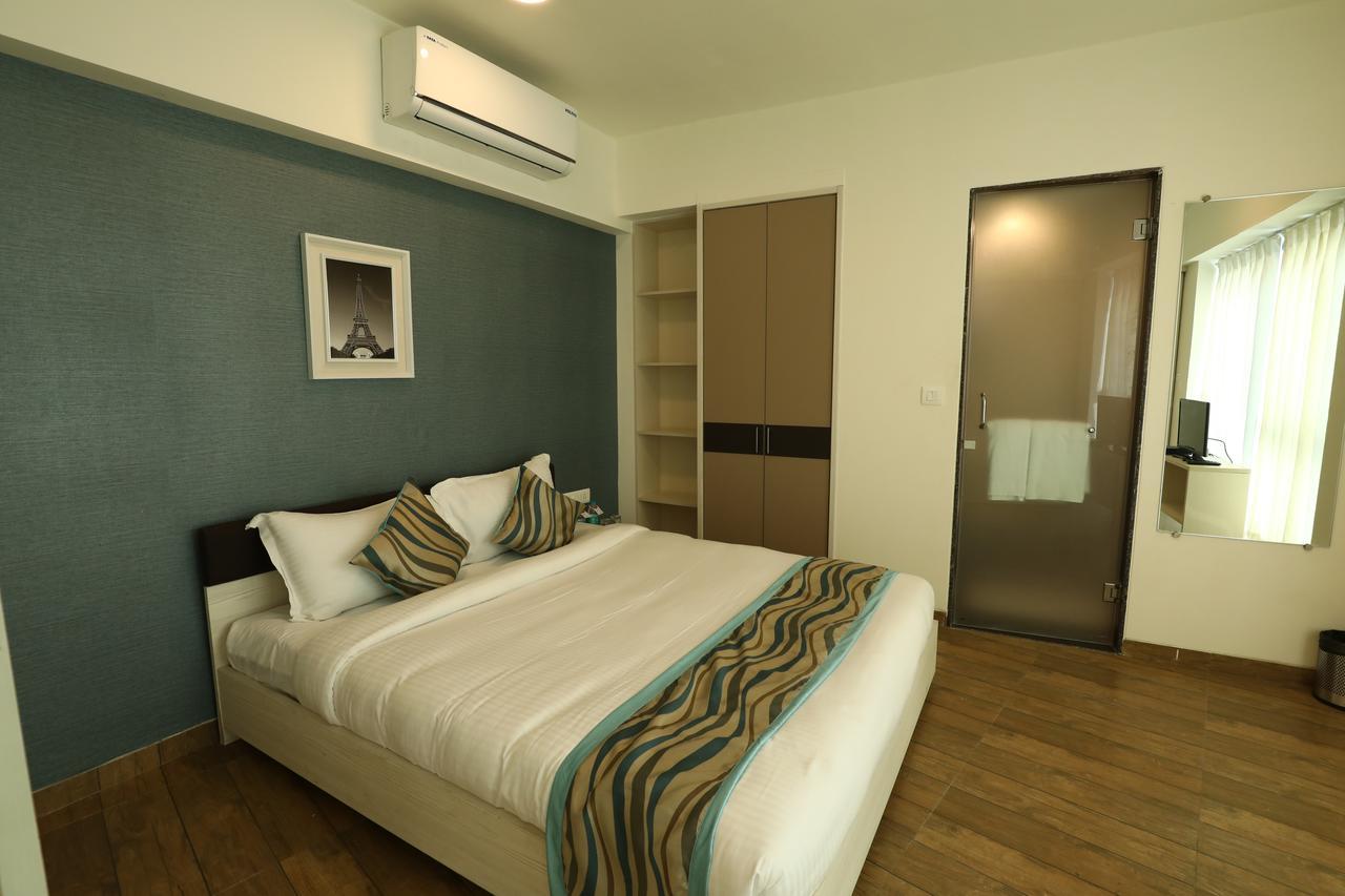 Rajhans Belliza Service Apartment Сурат Экстерьер фото