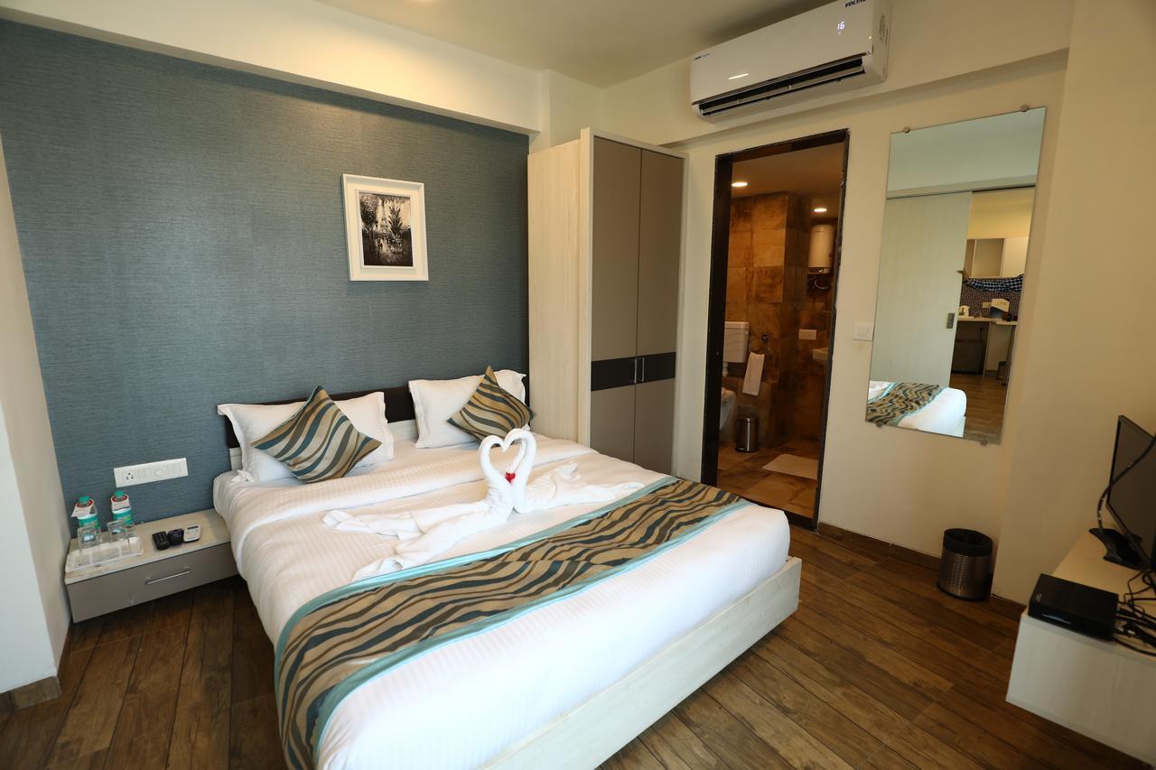 Rajhans Belliza Service Apartment Сурат Экстерьер фото